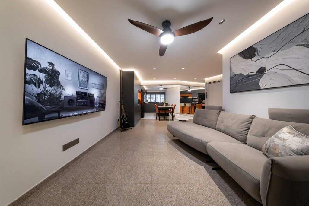 Open-concept living room layout with cove lighting and granite flooring.