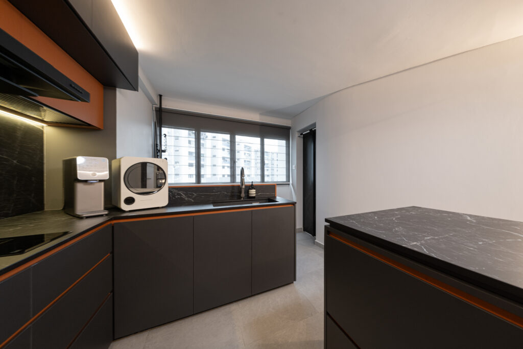 Moody dark kitchen with black marble look dekton sintered stone countertops.